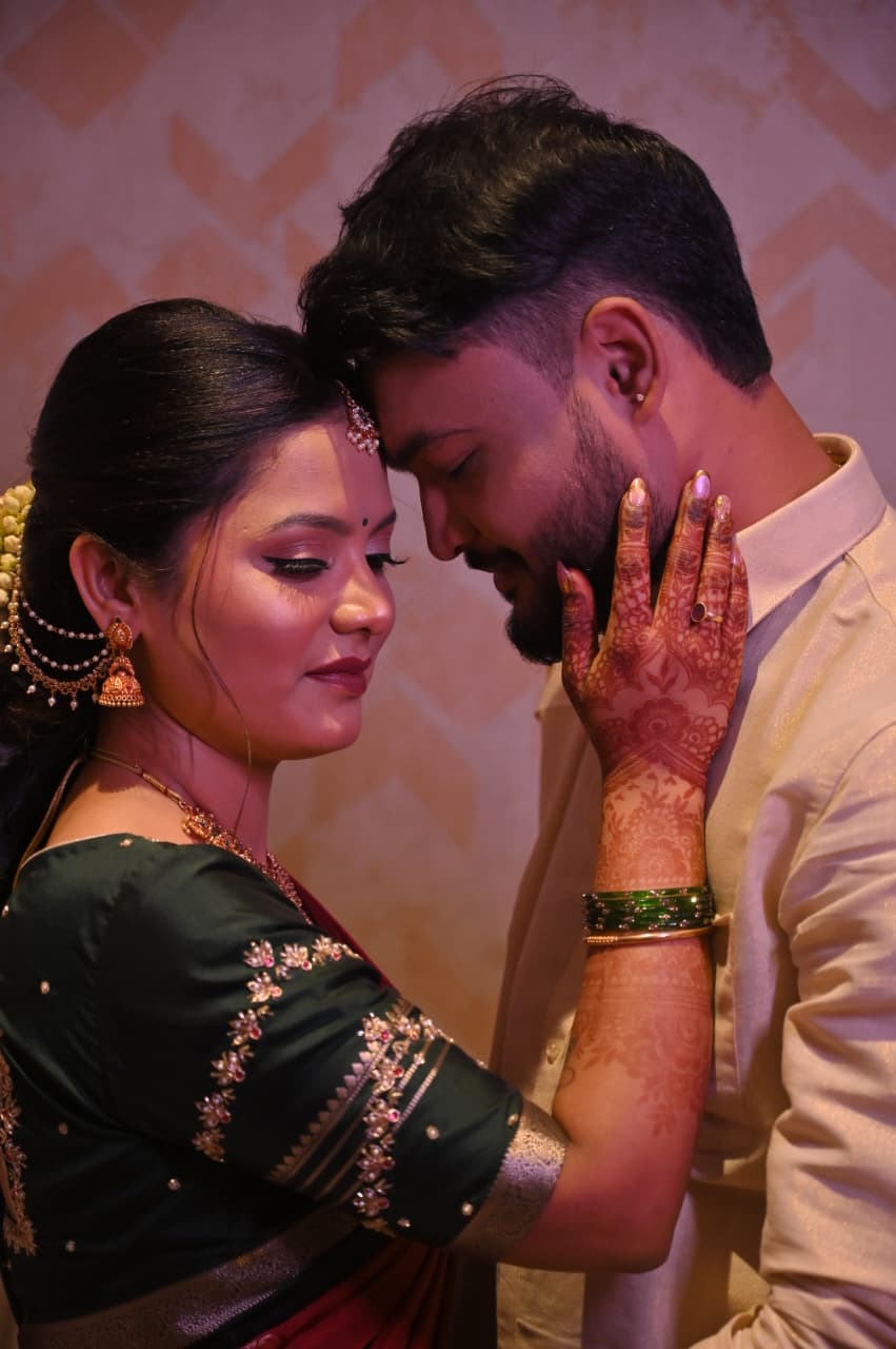 Soumya's mehndi-covered hand on Ravi's cheek